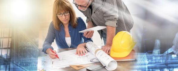 Architects working on plans; multiple exposure