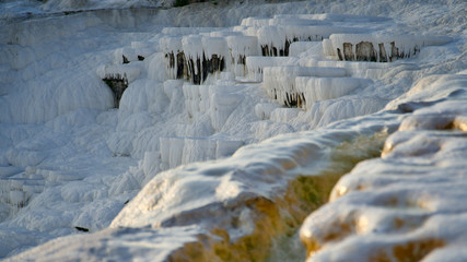 Fototapeta na wymiar Natural travertine pools and terraces in Pamukkale. It is on the World Heritage List and is under protection.