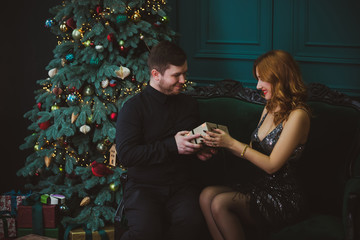 Concept of relationship among men and women. Psychology photo of couple at christmas time