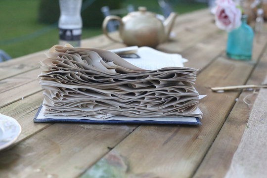 Book With Fancy Curled Pages On Table