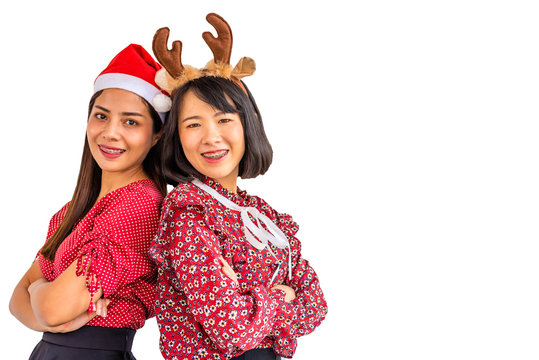 Isolate and clipping path image of the beautiful Southeast Asian women dressed in red shirt , black skirt and red hat on Christmas festival.