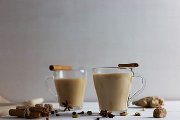 Flavoured masala Indian tea made by brewing black tea with milk, aromatic spices and herbs.