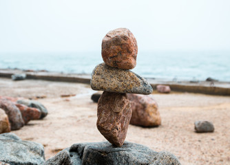 rocks balance on the seaside promenade, gravity balance of stones