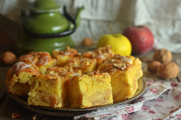 Apple pie cut into pieces on a metal tray