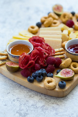 Appetizers gathered on a wooden board