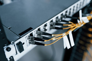 Close up view of internet equipment and cables in the server room