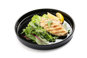 Plate with tasty grilled fish isolated on white
