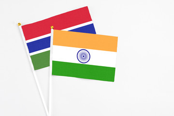 India and Georgia stick flags on white background. High quality fabric, miniature national flag. Peaceful global concept.White floor for copy space.