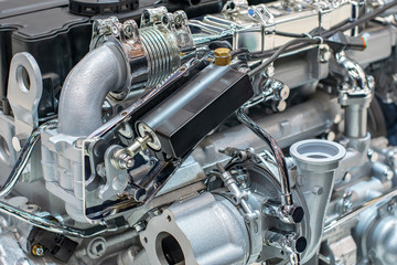 Engine with wires and hoses in the factory mechanism of iron and nickel plated steel