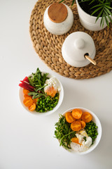 Benedict egg, arugula, tomatoes, green peas. Tasty lunch for two. 