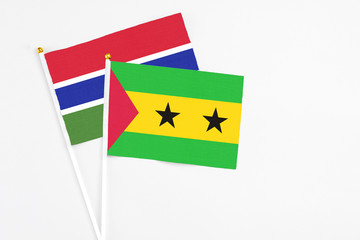 Sao Tome And Principe and Georgia stick flags on white background. High quality fabric, miniature national flag. Peaceful global concept.White floor for copy space.