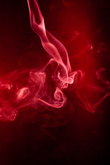 Fototapeta premium Red smoke motion on black background.