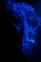 Blue smoke motion on black background.