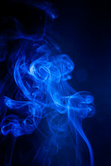 Blue smoke motion on black background.