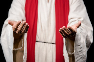 selective focus of man gesturing isolated on black
