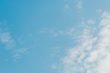 blue and clear sky with white clouds and copy space