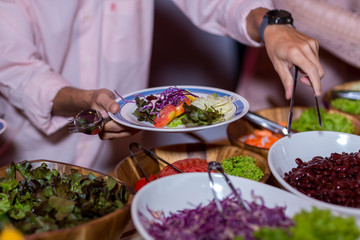 Food Buffet Catering Dining Eating Party Sharing Concept.people group catering buffet food indoor in luxury restaurant with meat colorful fruits and vegetables