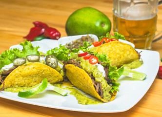 Mexican tacos with lemon and beer