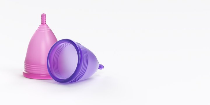 Two colored menstrual cups with white background.