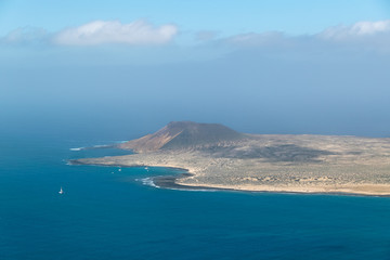 View from Lanzarote over the Atlantic with La Graciosa Island covered in calima