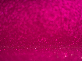Abstract magenta glitter bokeh lights, metallic sparkle. defocused.