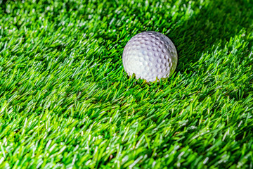 Golf ball on green grass