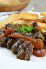 bourguignon beef and fries on a plate