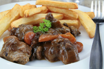 bourguignon beef and fries on a plate