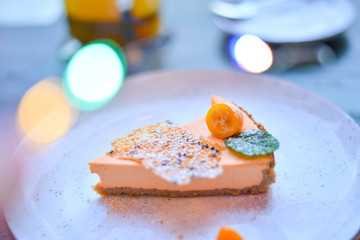 slice of cheesecake on a white plate on the table