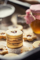 Christmas linzer sweets and cookies marmalade sugar powder in baked pan