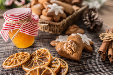 Gingerbread christmas cookies with jar of honey on kitchen table - Close-up
