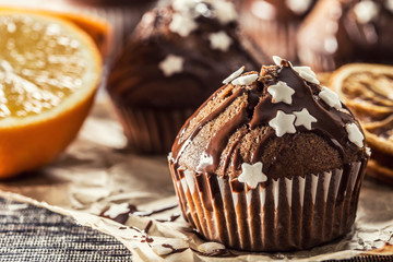Christmas chocolate delicious muffins sprinkled with topping and white stars