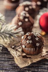 Christmas chocolate delicious muffins sprinkled with topping and white stars