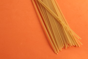 raw spaghetti pasta in colorful background