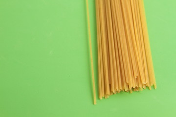 raw spaghetti pasta in colorful background
