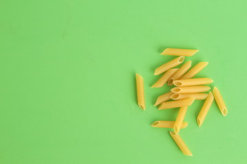 pasta raw feathers on colorful background