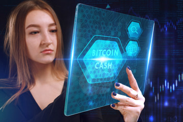 Business, Technology, Internet and network concept. Young businessman working on a virtual screen of the future and sees the inscription: Bitcoin cash