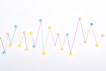 top view of colorful connected drawn lines with pins, connection concept