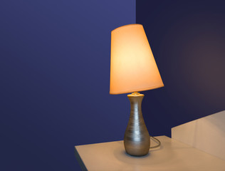 Table lamp near wall