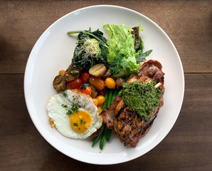 Steak fried egg saute vegetables