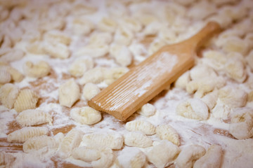 Fototapeta na wymiar Hands kneading dough for gnocchi.