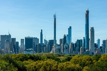 Naklejka premium New York skyscrapers over Central Park trees