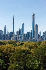 Fototapeta na wymiar New York skyscrapers over Central Park trees