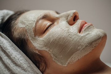 Beautiful Woman with a Facial Mask