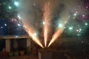 Celebration with illustration of exploding Firecracker A view of a type of firework, cracker named peacock cracker, during the Diwali festival celebrations in India.