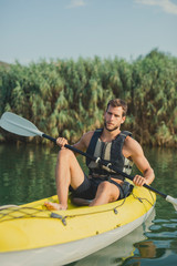 Man Kayaking on the River