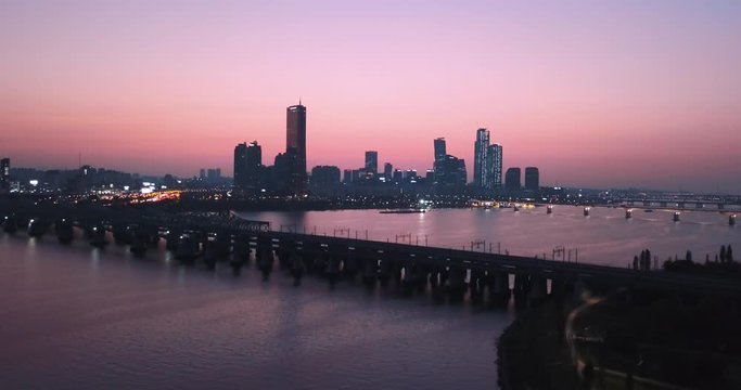 Drone Aerial footage Rising Up - showing buildings in Seoul, South Korea - Sunset