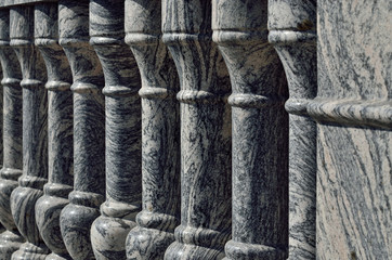 Beautiful gray marble balustrade illuminated by the bright sun