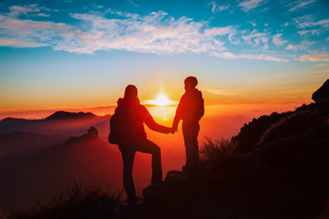 Fototapeta na wymiar mother and son travel in mountains at sunset, family hiking in nature