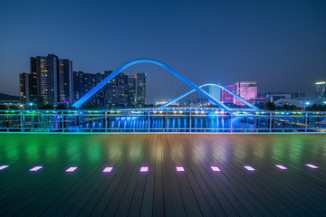 Unmanned wooden floor platform and city night skyline of Nansha District, Guangzhou